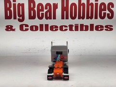 1/64 New DCP Orange & Silver 589 Peterbilt 58″ Mid Roof Sleeper Tractor