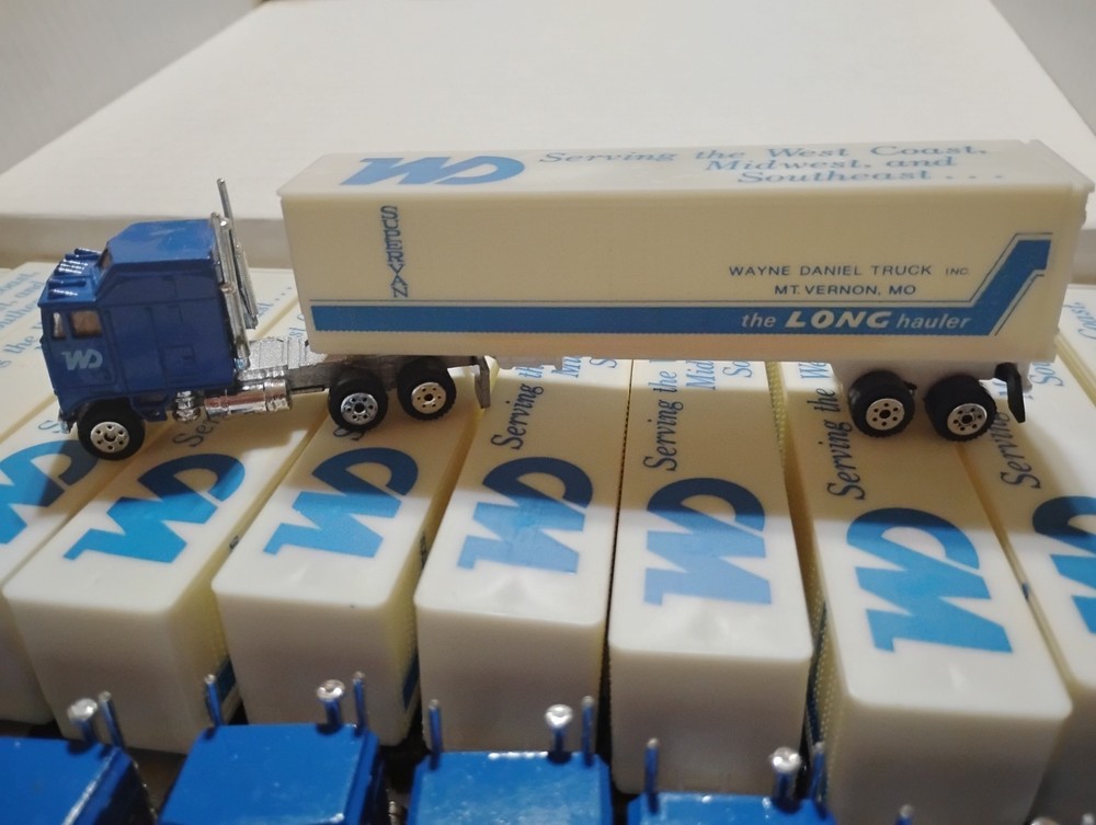 Box of 12 Road Champ Toy Semi Trucks for one money.
