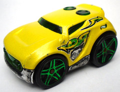 HOT WHEEL ROCKET BOX YELLOW 2″ DIECAST CAR WITH GREEN TRIM & RIIMS