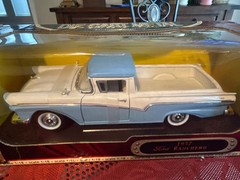 1:18 scale diecast replica of a 1957 Ford Ranchero in blue and white by Road Sig