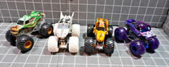 Lot of 4 Hot Wheels including Monster Jam Gears and Galaxies Pirates Curse 1/64