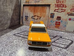 M2 Machines 1975 GMC Sierra Grande 15 Holley Yellow 1:64 Diecast Truck