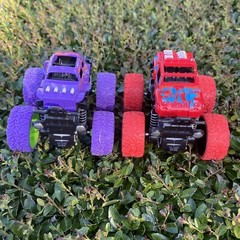(2) Monster Trucks Friction Powered Push And Go Toy Purple & Red Stunt Cars