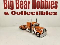 1/64 DCP/FG “Roark” Orange & White 389 Peterbilt 63″ Flattop Sleeper Tractor