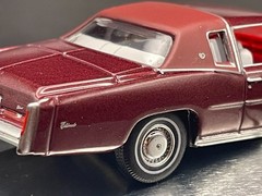 AUTO WORLD 1975 CADILLAC ELDORADO LUXURY CRUISER IN FIREMIST POLY W/RUBBER TIRES