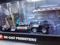 1/64 DCP PETERBILT 389 DAY CAB W/ Wilson Flat Bed Spread Axle.
