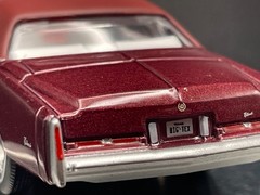 AUTO WORLD 1975 CADILLAC ELDORADO LUXURY CRUISER IN FIREMIST POLY W/RUBBER TIRES