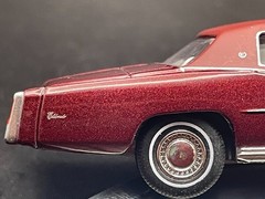 AUTO WORLD 1975 CADILLAC ELDORADO LUXURY CRUISER IN FIREMIST POLY W/RUBBER TIRES