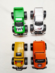 NEW BRIGHT Monster Trucks Set Of 4 – Working fine but slightly worn