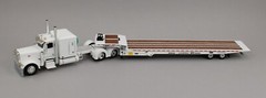 DCP 1:64 *WHITE* Peterbilt 389 63″ Flattop w/LANDOLL 440 Traveling Axle Trailer