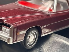AUTO WORLD 1975 CADILLAC ELDORADO LUXURY CRUISER IN FIREMIST POLY W/RUBBER TIRES