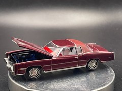 AUTO WORLD 1975 CADILLAC ELDORADO LUXURY CRUISER IN FIREMIST POLY W/RUBBER TIRES