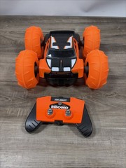 New Bright (1:16) Super Rebound Remote Control Orange Stunt Vehicle READ DESCR..