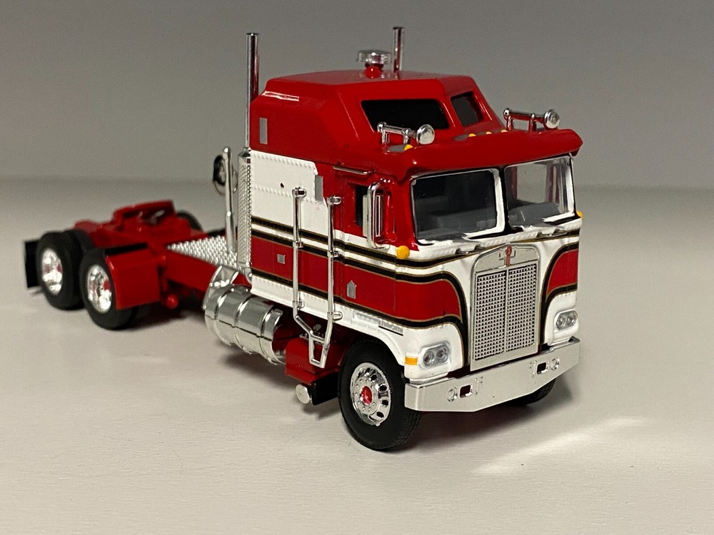 DCP 1/64 RED & WHITE KENWORTH K100 AERODYNE LONG FRAME W/CAT MOTOR